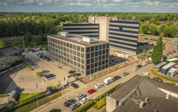 Aerial view of the office buildings at Moutlaan 1-23, Enschede, showcasing available office space rental options.
