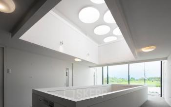 Modern office space with a unique ceiling design at Transportlaan 1-151, Geleen, available for office space rental.