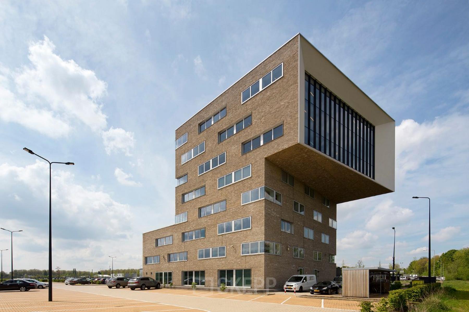 Modern office building at Transportlaan 1-151 in Geleen, featuring large windows and unique architecture suitable for office space rental.