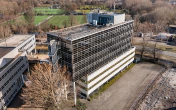 Aerial view of the office building located at Groningenweg 8 8, Gouda, surrounded by greenery.