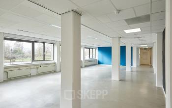 Spacious office to rent in Groningen at Schweitzerlaan 12, featuring large windows and an open layout perfect for customizable office space rental.