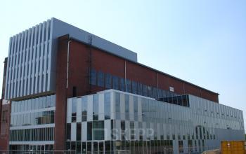 Office to rent at Helperpark 270-298 in Groningen, showcasing a modern building exterior with large windows and multiple levels.