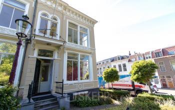 Exterior view of an office building at Prinsen Bolwerk 1, Haarlem Centraal Station with large windows and classic architecture.