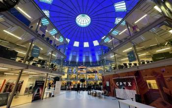 Spacious office interior at Koepelplein 1E, Haarlem Centrum, featuring a striking blue dome and multiple workspaces ideal for office space rental.