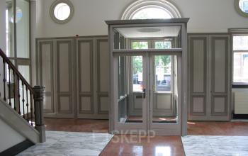 Elegant entrance with marble flooring and large windows located at Wilhelminastraat 43A, Haarlem Centrum, Haarlem, suitable for office space rental.