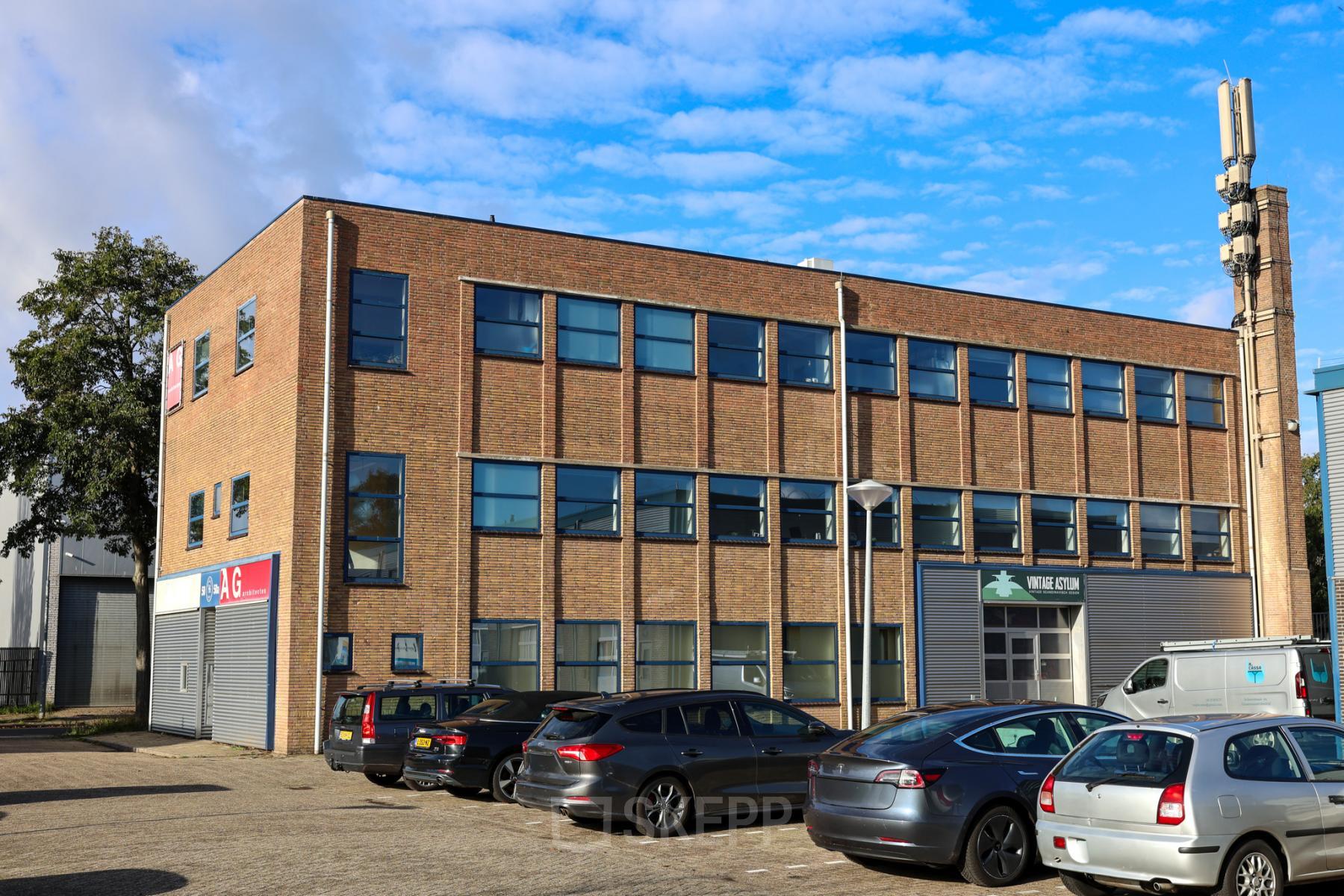 Exterior view of an office building located at Nijverheidsweg 50 in Haarlem Oost, showcasing a potential office space rental.