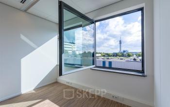 Bright office space with open window and view of Haarlem Waarderpolder, ideal for rent office space.