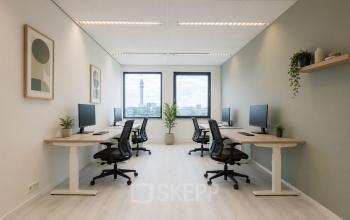 Bright and modern office space at Mollerusweg 84, Haarlem Waarderpolder, featuring workstations with ergonomic chairs and large windows overlooking the skyline. Ideal for office space rental.