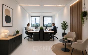 Two people working at desks in a modern, furnished office space at Mollerusweg 84, Haarlem Waarderpolder, suitable for office space rental.