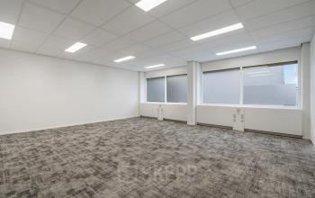 Spacious, carpeted office space with large windows in Haarlem Waarderpolder, ideal for rent office space needs.