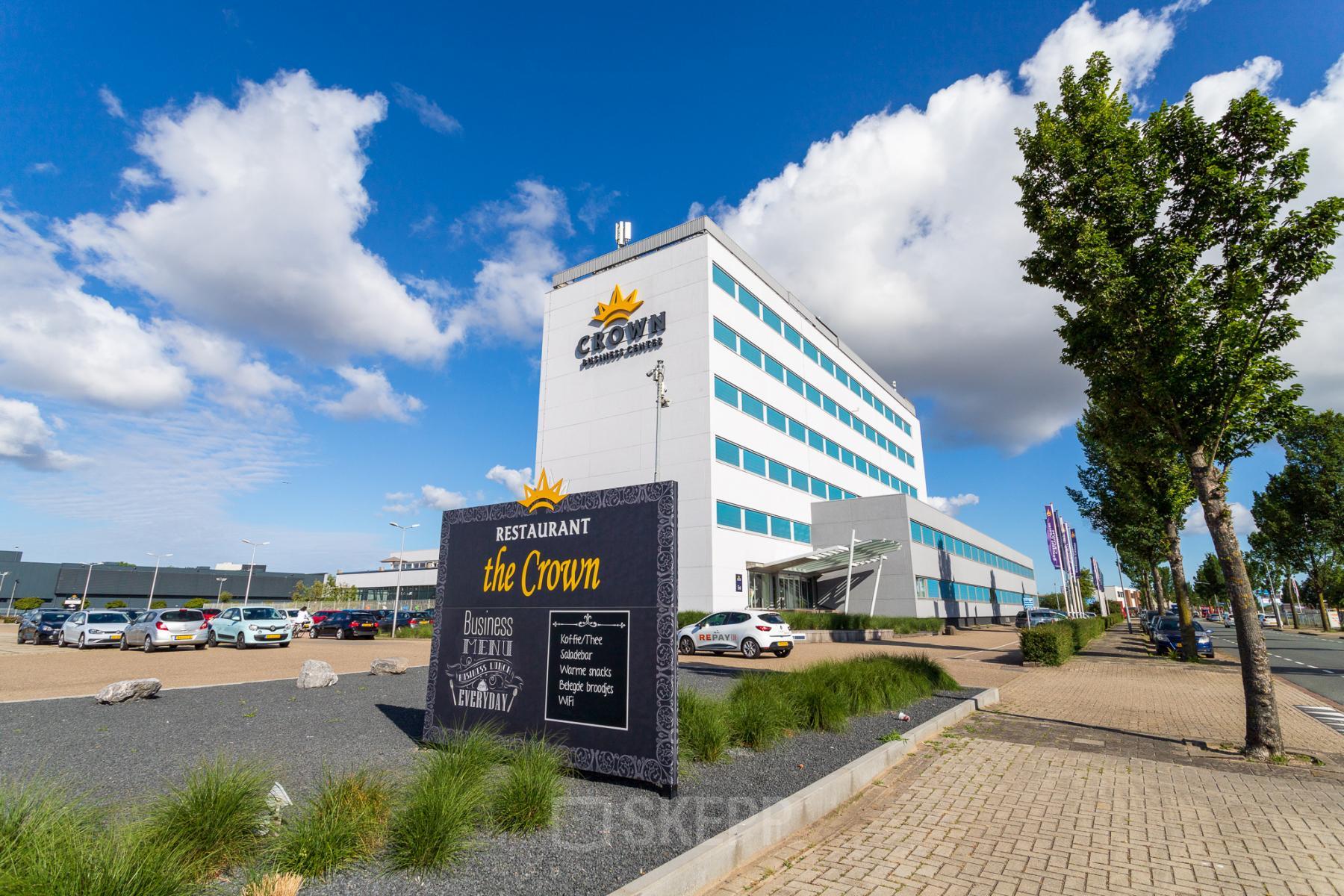 Exterior of the office building at A. Hofmanweg 5A, Haarlem Waarderpolder, Haarlem, featuring modern design and nearby parking area. Suitable for those looking for office space rental.
