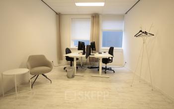 Bright office space at Waarderweg 19, Haarlem Waarderpolder, featuring two workstations with computers, ideal for office space rental.