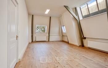 Bright office space with wooden flooring and large windows at Dreef 34, Haarlem Zuid, Haarlem. Ideal for office space rental.
