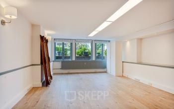 Bright, unfurnished office space with large windows and wooden flooring at Dreef 34, Haarlem Zuid, Haarlem.