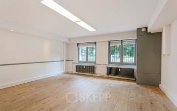 Bright, unfurnished office space with large windows and wooden floors at Dreef 34, Haarlem Zuid, Haarlem available for office space rental.