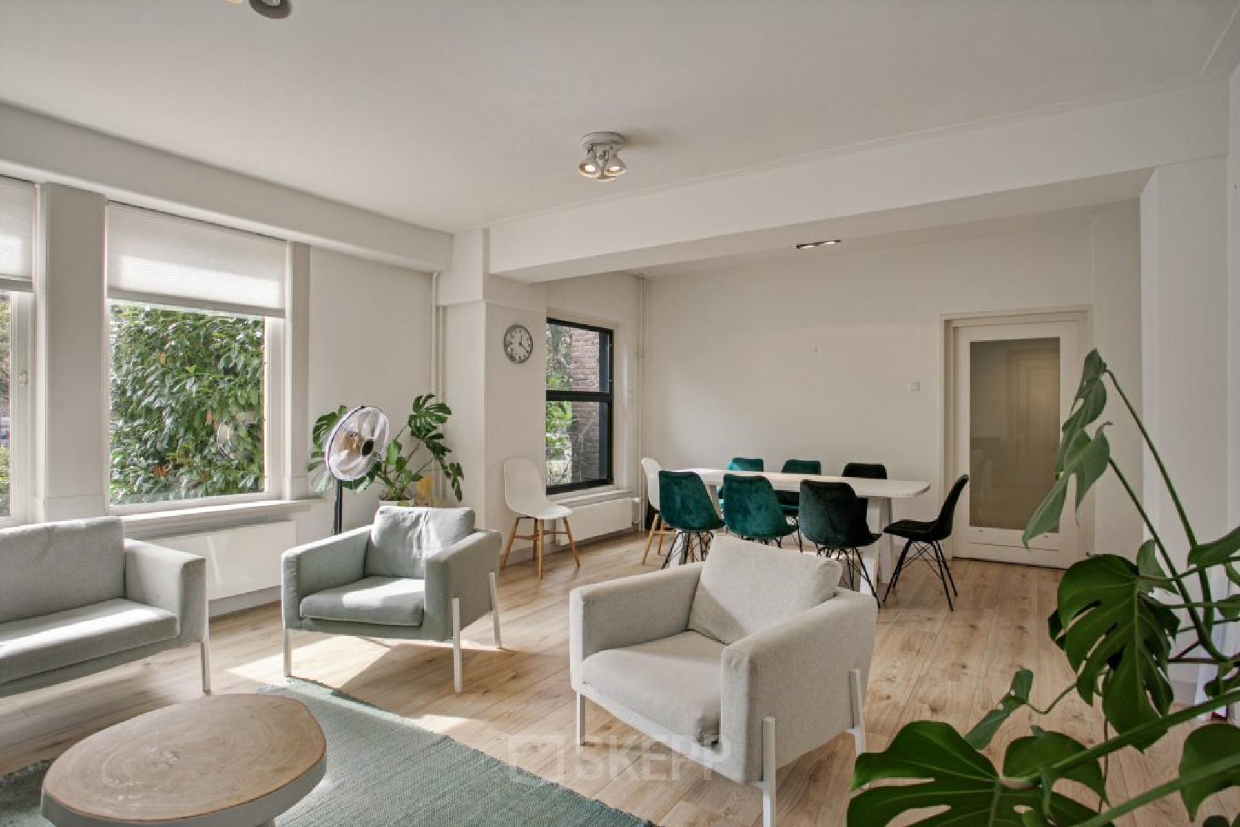 Modern office space rental with bright, furnished workspaces and seating area at Florapark 7, Haarlem Zuid.