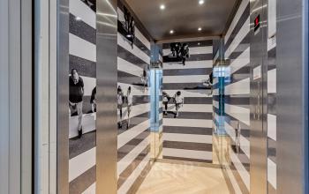 Elevator area with striped wall decor at an office building located at Fonteinlaan 5, Haarlem Zuid, Haarlem.