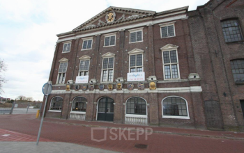 Historic brick office building at Haarlemmerstraatweg 7, Halfweg, view of exterior facade with classical architecture available for office space rental.