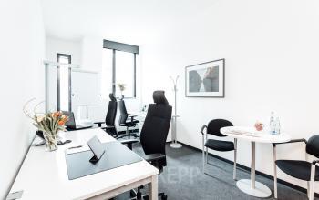 Bright office space rental in Hamburg Hafencity at Überseeallee 1, featuring modern furnishings, ergonomic chairs, and a sleek workspace design ideal for professionals.