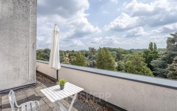 Exterior view from the terrace at Oliemolenstraat 60, Heerlen featuring outdoor seating with scenic views.