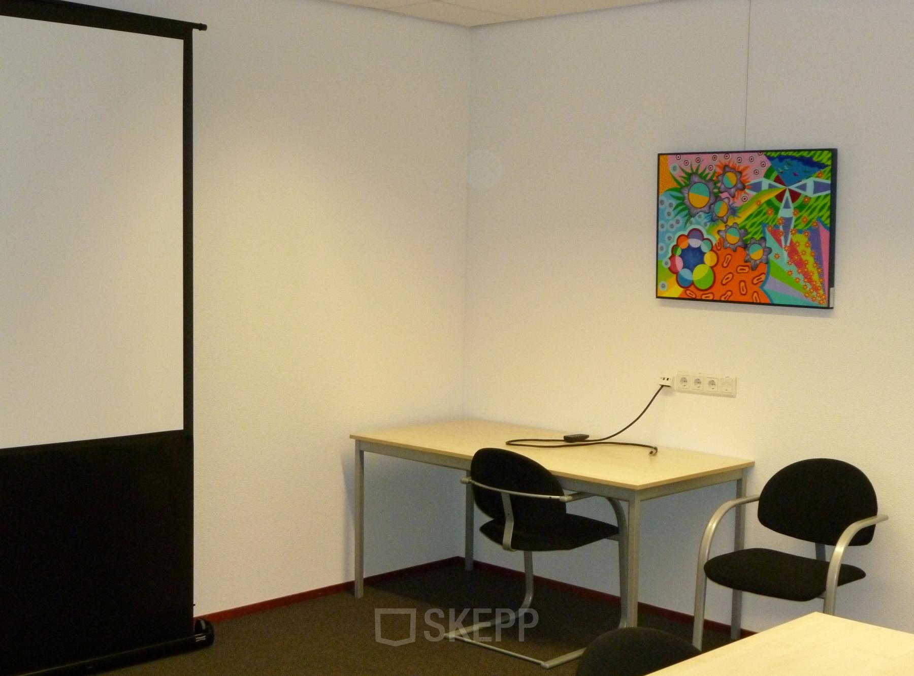 Modern office space rental at Jan Tinbergenstraat 202, Hengelo, featuring a vibrant painting, desk with chairs, and ample lighting.