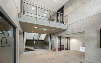 Spacious entrance at Lintelerweg 40, Hengelo, offering office space rental with modern design and expansive layout.