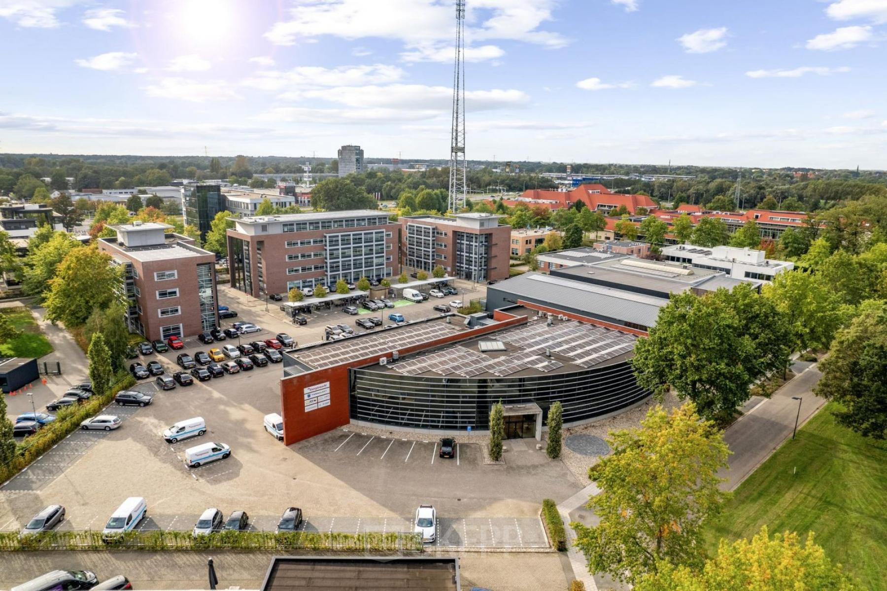 Aerial view of Lintelerweg 40, Hengelo, showcasing multiple office buildings with parking spaces for office space rental.