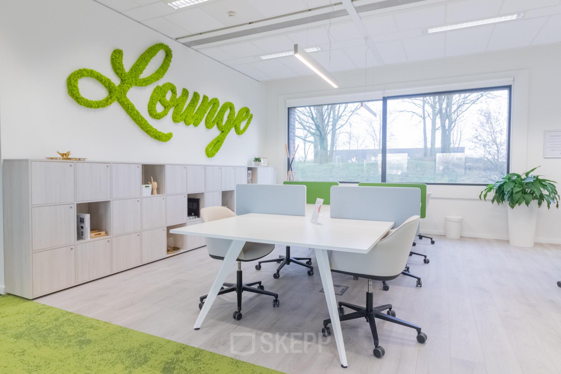 Modern office interior at Atealaan 34A, Herentals, featuring collaborative workspaces with stylish furnishings, green accents, and ample natural light. Ideal for businesses seeking office space rental in a vibrant setting.