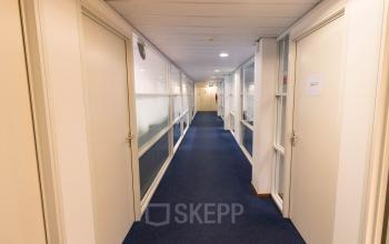 Bright hallway in an office building at Franciscusweg 219, Hilversum, showcasing potential for office space rental.