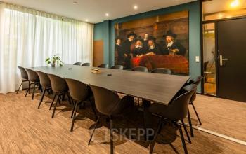Conference room at Steijnlaan 16, Hilversum, ideal for office space rental with a long table and chairs, offering a professional setting for meetings.