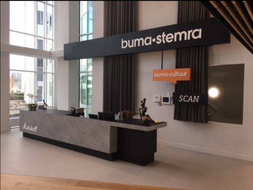 Reception area at Saturnusstraat 40-62 in Hoofddorp, featuring a modern counter and signage. Ideal for those looking to rent office space in a contemporary setting.
