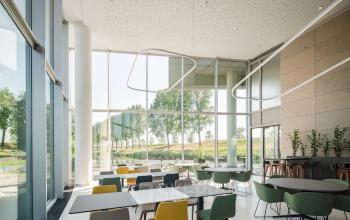 Modern office space with stylish seating and large windows at Taurusavenue 1-41, ideal for rent office space in Hoofddorp.