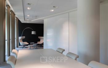 Spacious, modern office space rental with neutral decor and contemporary furniture at Taurusavenue 1-41, Hoofddorp. Perfect office to rent for meetings or collaborative work.