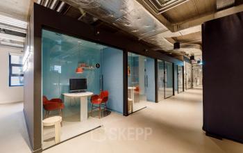 Furnished office space rental with modern workspaces featuring glass-enclosed units at Siriusdreef 16, Hoofddorp.