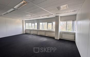Spacious office space at Planetenweg 5, Hoofddorp with ample natural light from large windows, ideal for office space rental. The room is unfurnished, offering a blank canvas for your business setup.