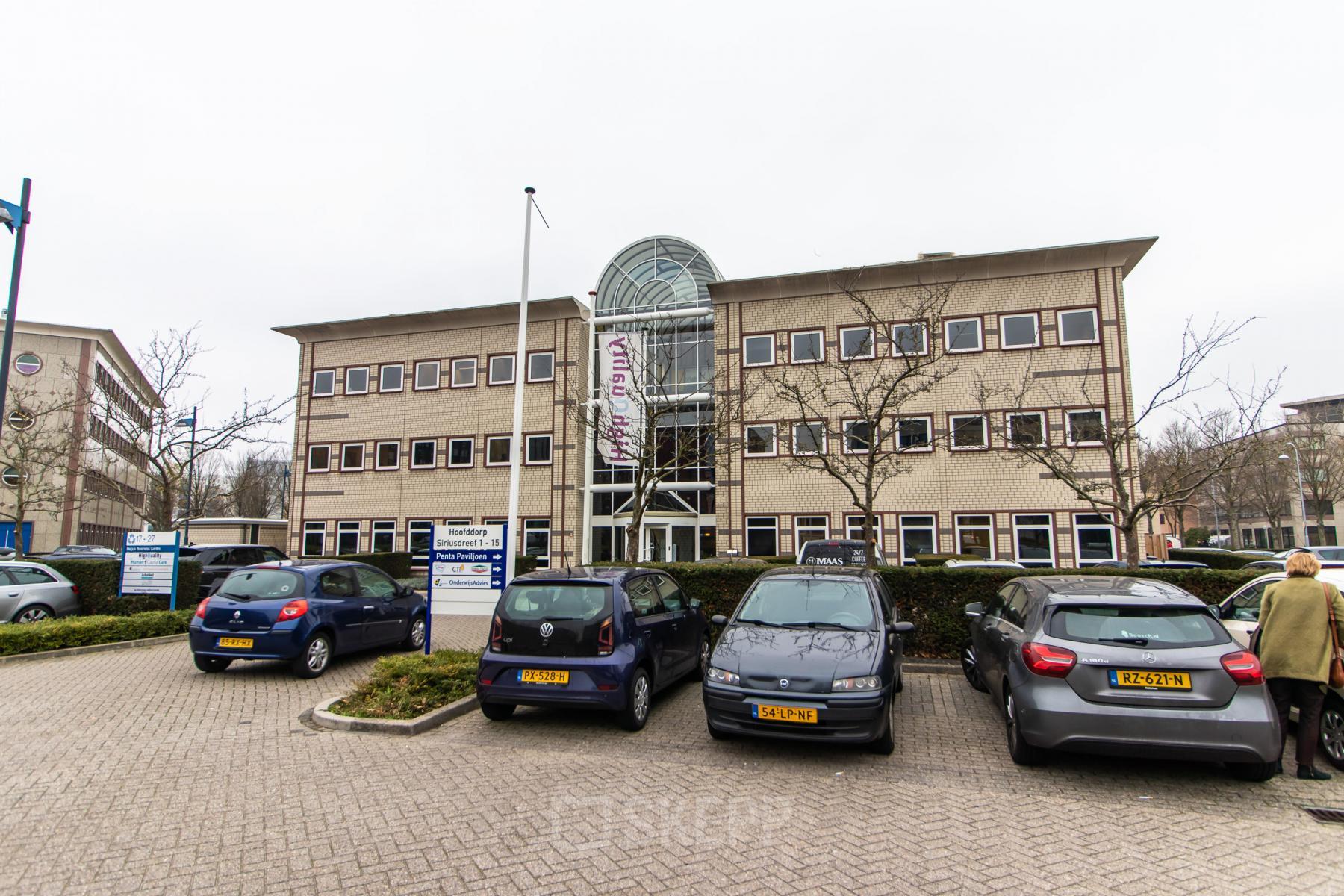 Exterior view of office space rental at Siriusdreef 17, Hoofddorp, showing the building facade with parked cars in front.