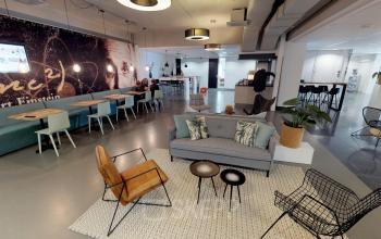Stylish office space at Meidoornkade 22, Houten, featuring modern furnishings and multiple work areas. Ideal for those seeking office space rental with creative, open-floor layouts.