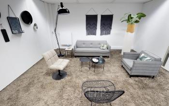 Stylish office space rental at Meidoornkade 22, Houten, featuring chic furniture with modern decor elements.