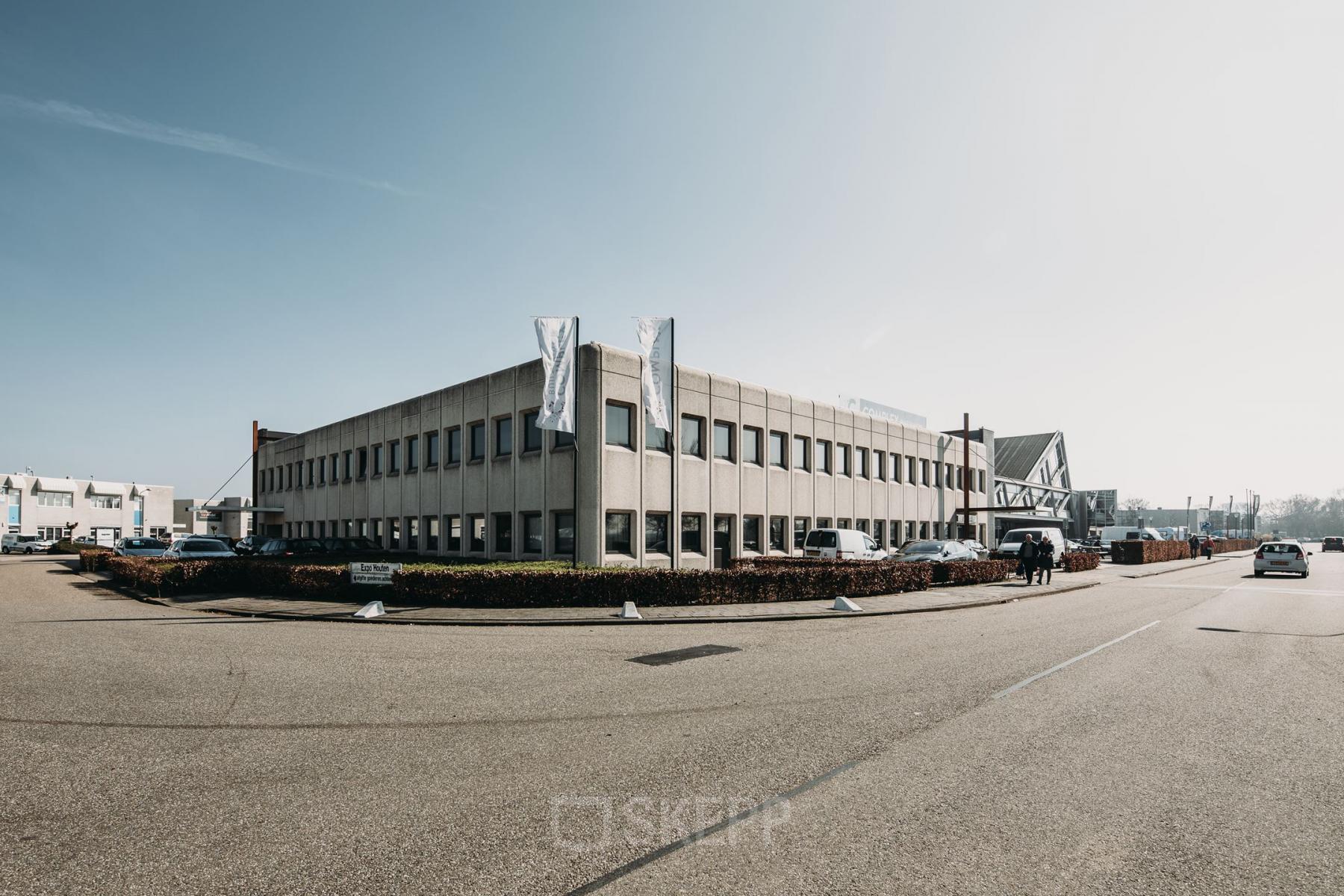 Exterior view of a two-story office building at Meidoornkade 22, Houten, ideal for office space rental.