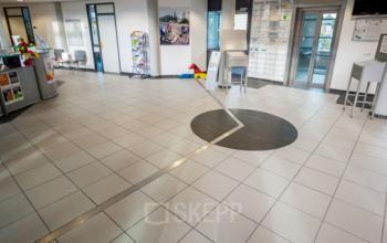 Spacious, tiled reception area with modern design at the office space rental located at Eurodepark 1, Kerkrade, Kerkrade.
