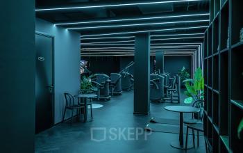 Sleek, modern office space rental at Oudhuizerstraat 31, Klarenbeek, with minimalist furnishings, LED lighting, and an open floor plan.