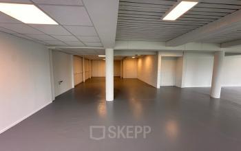 Spacious office space available for rent at Zwettestraat 15, Leeuwarden. The interior features a clean, open layout with neutral colors and ample lighting, ideal for customizable workspaces.