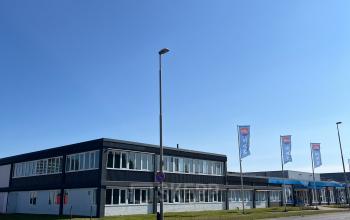 Exterior view of the office building at Zwettestraat 15, Leeuwarden. The building features a modern facade with large windows, ideal for businesses seeking office space rental with good accessibility.