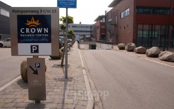 Exterior view of Pompoenweg 3 - 15, Leiden, featuring Crown Business Centers sign and parking area.