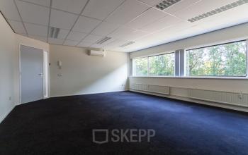 Spacious office to rent at Fruitweg 38, Leiden, featuring large windows and abundant natural light. Ideal for office space rental with a flexible layout.