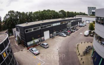 Aerial view of a business area at Fruitweg 38 in Leiden, showcasing various office spaces available for rent with parking access.