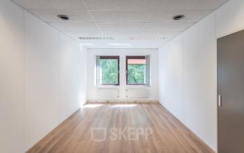 Office space in Leiden at Kanaalpark 157 ready for office space rental, featuring a clean, open layout with wooden floors and natural light.