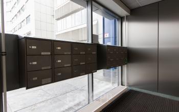 Exterior view of mailboxes near the window at the office located at Vlietweg 17, Leidschendam, available for office space rental.