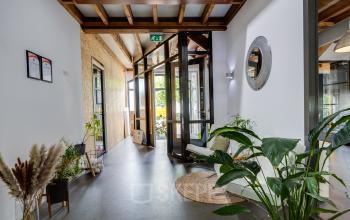 Bright office interior at Hamersveldseweg 120, Leusden, featuring modern decor with plants and stylish furnishings, perfect for office space rental opportunities.