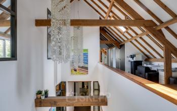 Interior view of Hamersveldseweg 120, Leusden, showcasing an office space rental with modern decor and wooden beams.